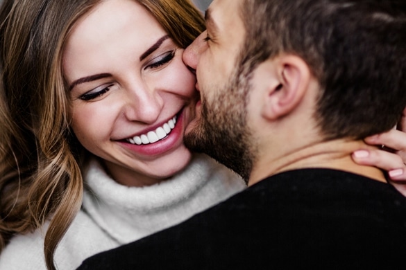 Young couple in love hug each other - what does a taurus man like about the scorpio woman